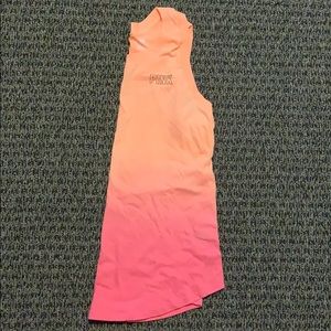 Cute tank top, never worn! Cute slit in back